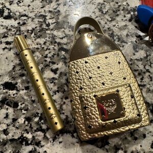 MCM Gold Perfume Bottle with Black Details